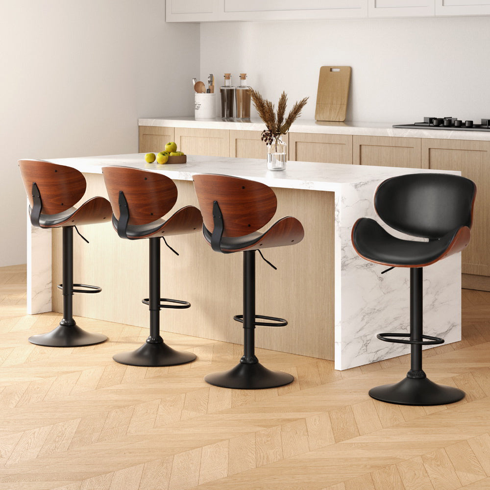 Artiss 4x Bar Stools Gas Lift Leather Padded Black
Enhance your home decor with Artiss Joyce bar stools - a stylish and versatile piece designed to match your personal flair. The sleek design, premium material, and intricate details make it a perfect addition to any modern space. The curved frame and backrest provide optimal support for your lower back, and the semi-circular footrest adds extra comfort. With its plush seats, you can relax and enjoy engaging conversations with ease.