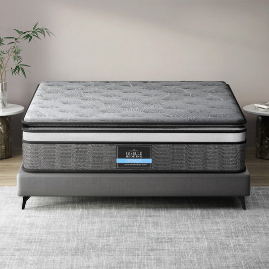 A double-layer pocket spring mattress by Giselle Bedding, displayed on a bed frame, with a quilted design on the surface.