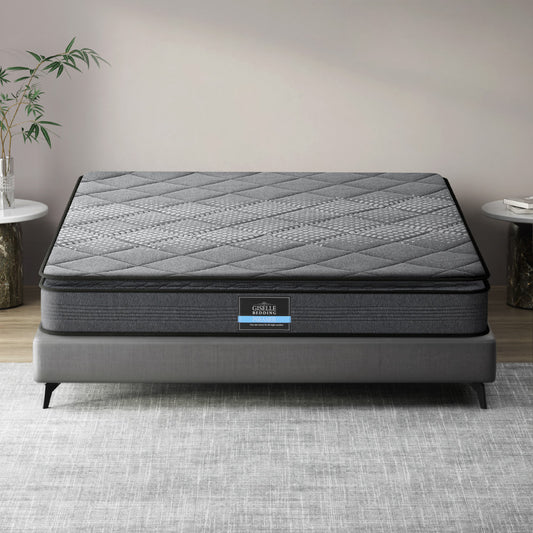 A queen-sized Giselle Bedding Ella Series Pillow Top mattress with a thickness of 18cm, displayed on a bed frame in a room setting.