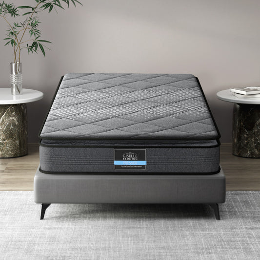 Single-sized Pillow Top mattress by Giselle Bedding, displayed on a bed frame, with a textured gray quilted design on the surface.