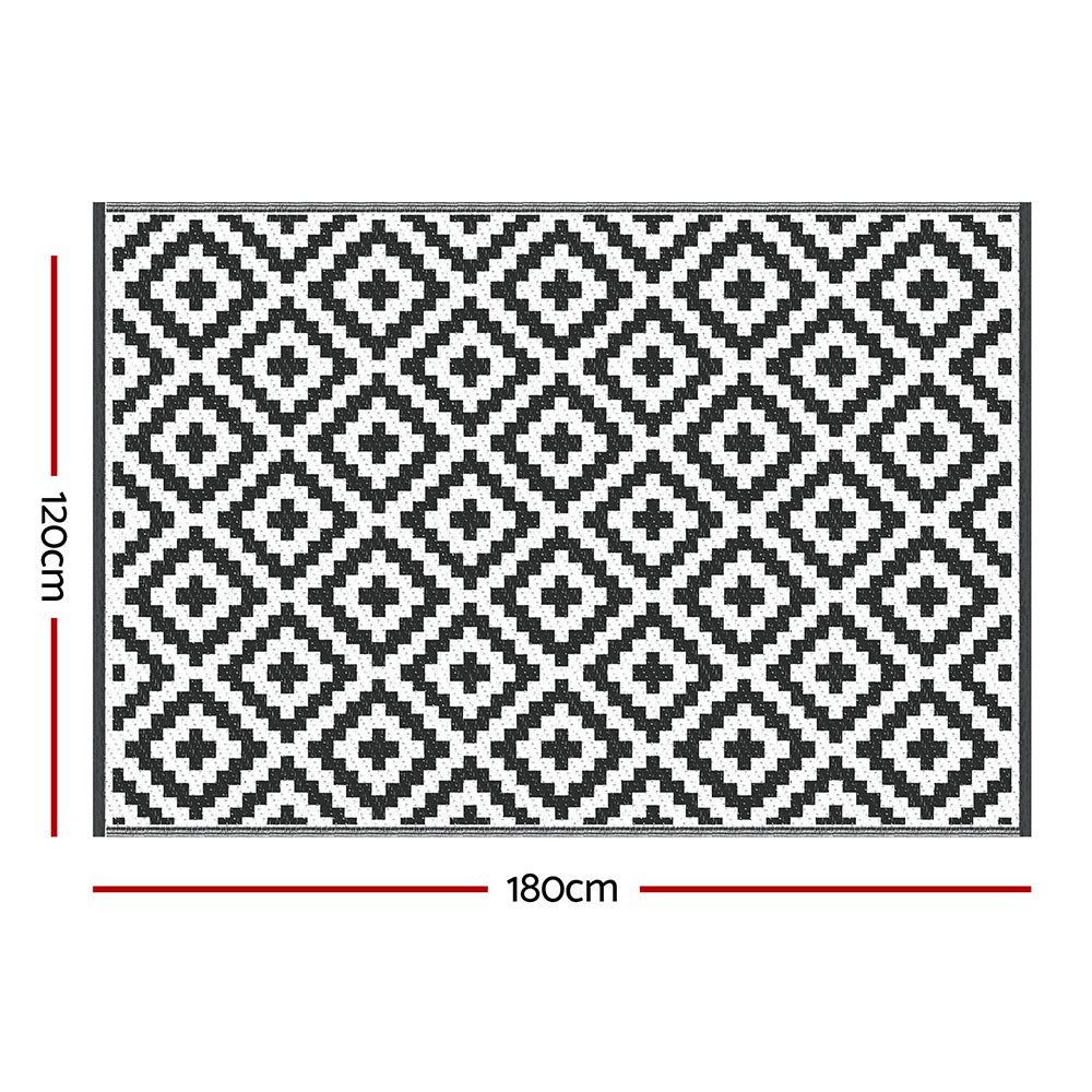 Black and white geometric patterned rug with dimensions on a white background