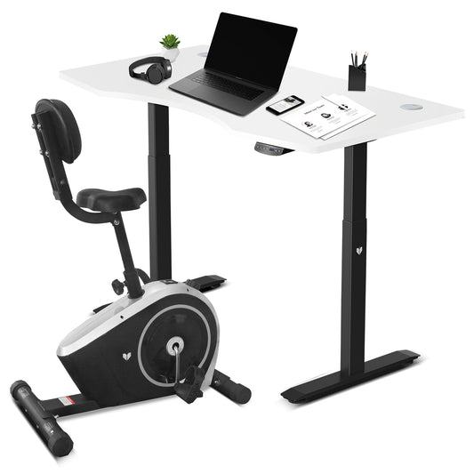 An exercise bike with an attached desk, in white and black colors, showcasing the bike's console and the beginnings of a setup for a workspace.