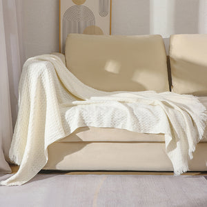 130*230CM Off White Nordic Solid Color Knitted Sofa Throw Blanket with Tassels – Waffle Weave Polyester Decorative Blanket

Elevate your living space with our Off White Knitted Sofa Throw Blanket. This Nordic-inspired blanket is made of soft, waffle weave polyester and features charming tassels for added style. Perfect for snuggling on the couch or adding a decorative touch to your room. Available in a generous 130*230CM size