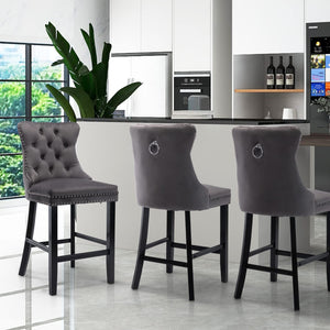 4X Velvet Bar Stools with Studs Trim Wooden Legs Tufted Dining Chairs Kitchen

Crafted with a blend of transitional and Hollywood glamour, these velvet-upholstered dining chairs are the epitome of comfort and style. The luxurious velvet fabric and sturdy wooden legs add a touch of elegance to any dining area. The silver studs lining the cushion and backrest serve as eye-catching accents, completing the chair's overall design. With its soft velvet upholstery and ergonomic design, this chair offers a comforta