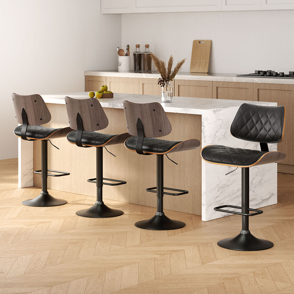 Artiss 4x Bar Stools Kitchen Dining Chairs Gas Lift Stool Wooden Leather Black

Experience the Artiss Quilla Bar Stools, where luxury and state-of-the-art design come together. These stools offer a cushioned seat covered in top-of-the-line PU leather, paired with a uniquely curved bentwood seat showcasing a stunning wood grain finish. Enjoy complete flexibility with a 360-degree swivel seat and adjustable height thanks to the SGS-tested gas lift lever, while also safeguarding your floors with a discreet flo