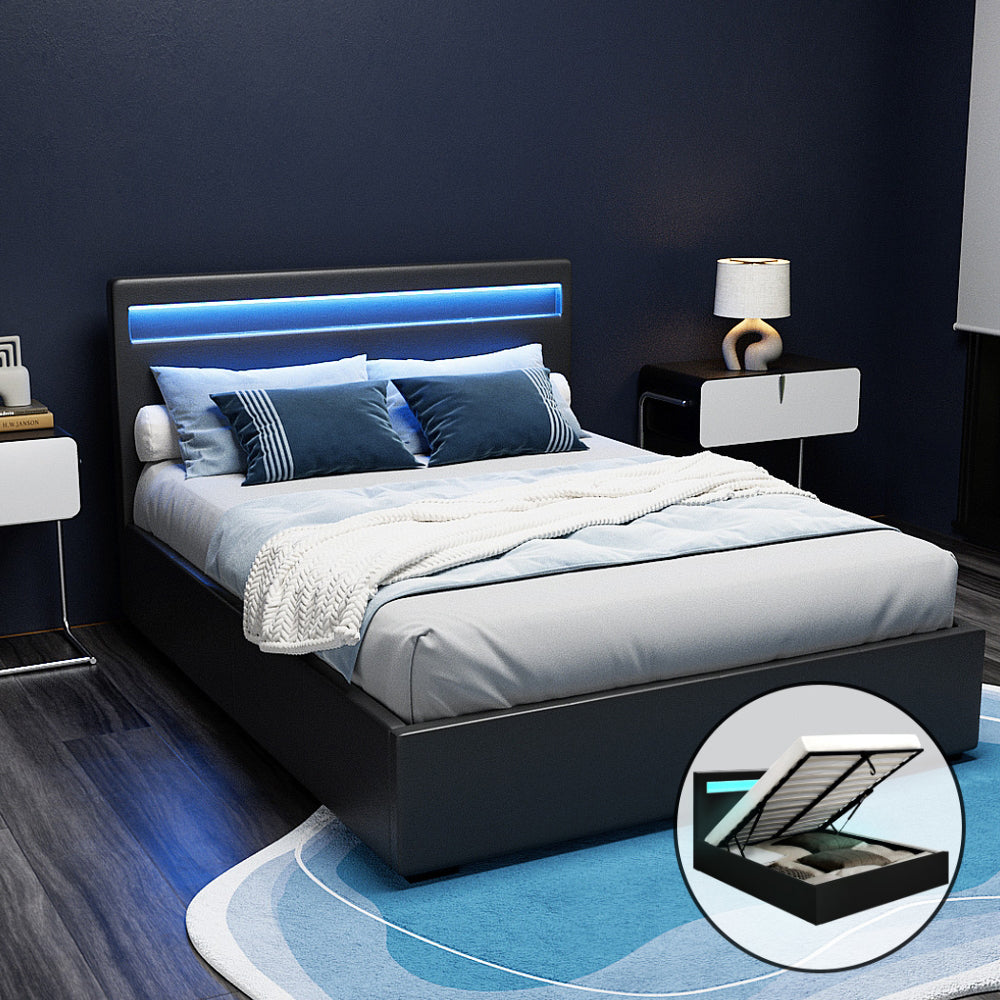 A black double-sized Artiss LED gas lift bed frame with a padded headboard and LED lights, placed in a room setting with a visible storage compartment underneath.
