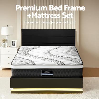 Black bed frame with mattress set in a bedroom setting