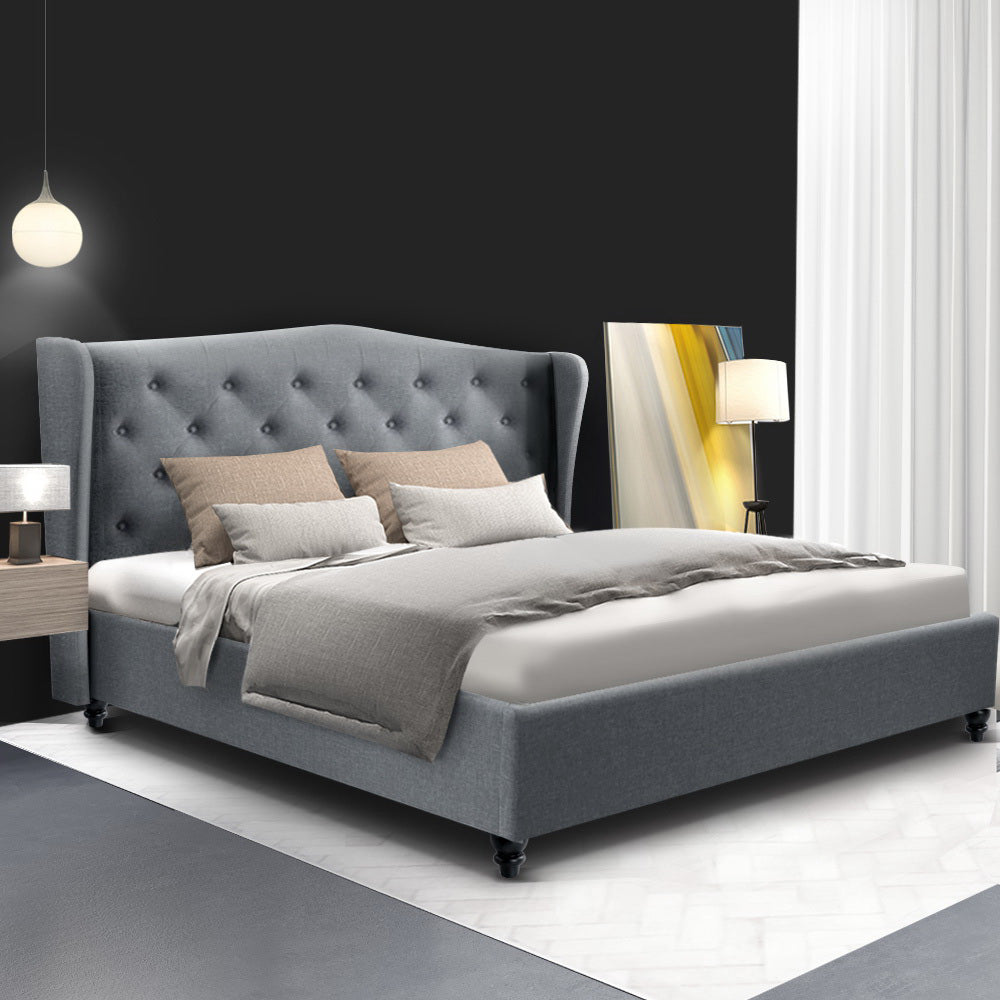 A double-sized grey fabric bed frame with a tufted headboard, upholstered in non-woven linen fabric, set in a modern bedroom interior.