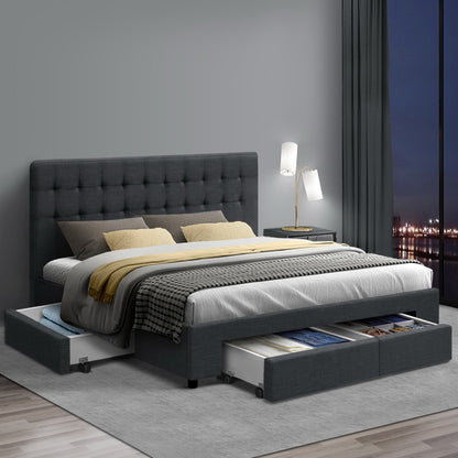 Gray upholstered bed with storage drawers in a modern bedroom setting.