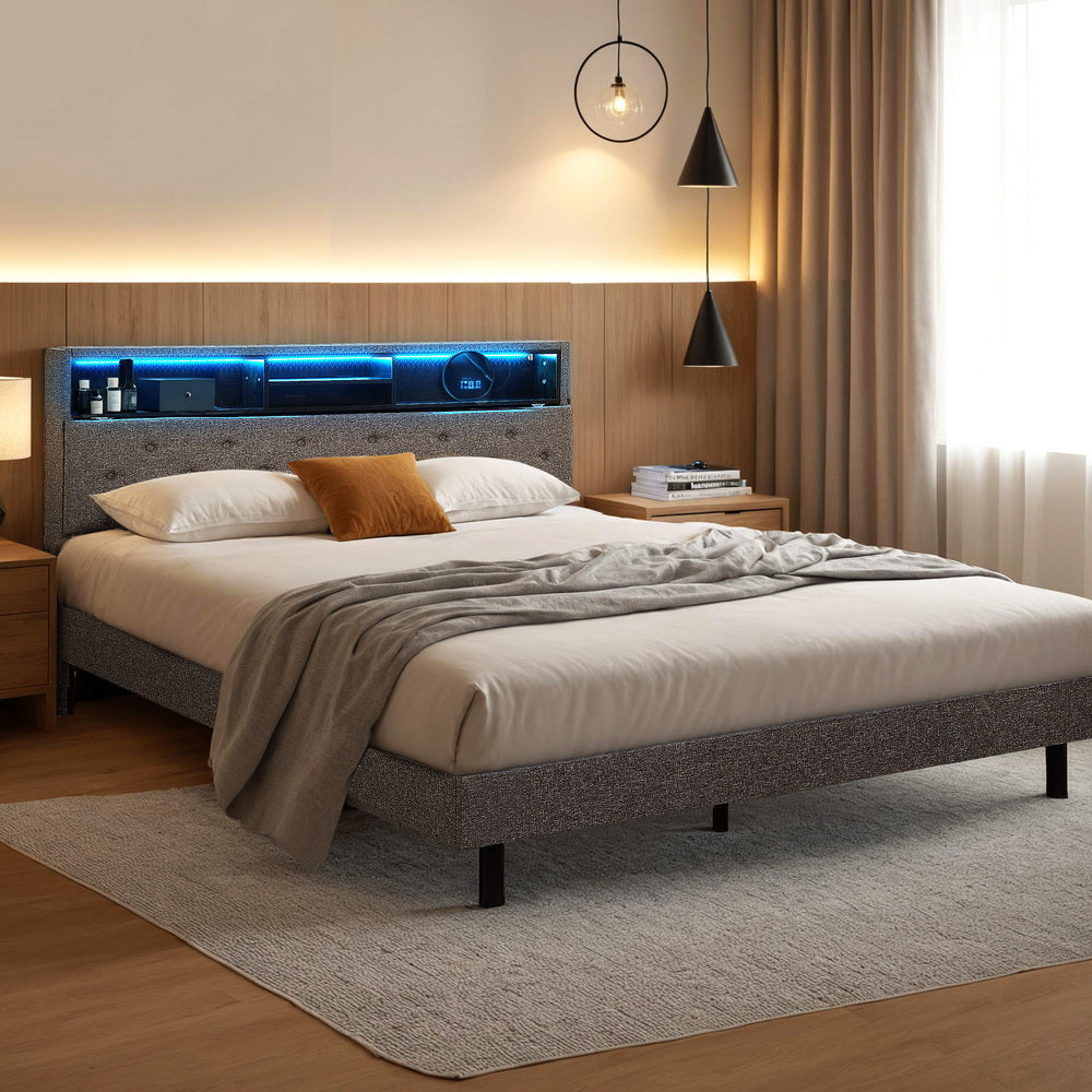 Modern bedroom with a bed featuring a headboard with built-in lighting.