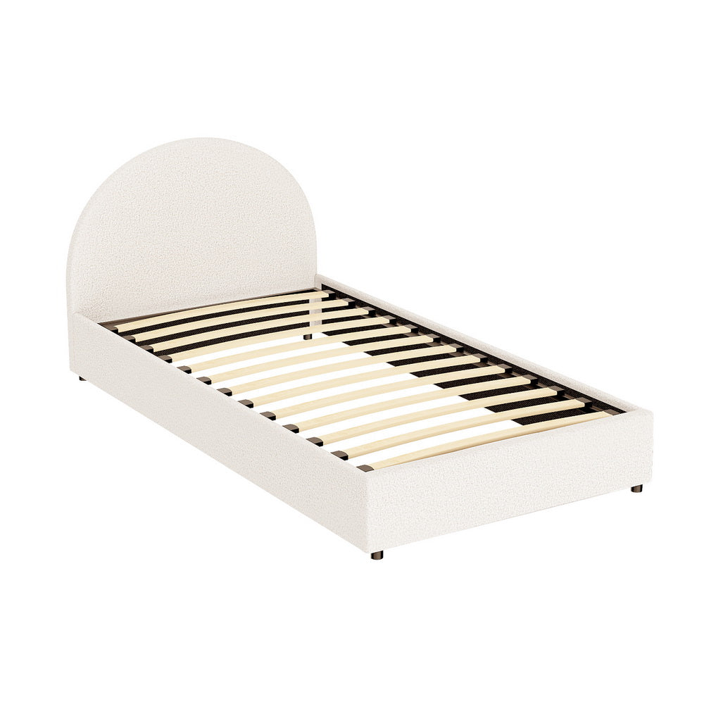 White bed frame with curved headboard on a white background