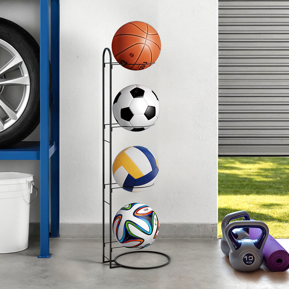 Basketball and soccer ball on a stand in a garage setting with a car tire and storage shelves.