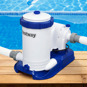 Pool pump with 'Bestway' branding on a wooden deck by a pool.