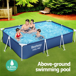 Family playing in a Bestway Steel Pro above-ground swimming pool in a backyard.
