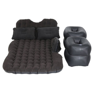 Inflatable car mattress and pillows in charcoal color, with foot pump, laid out on a white background.