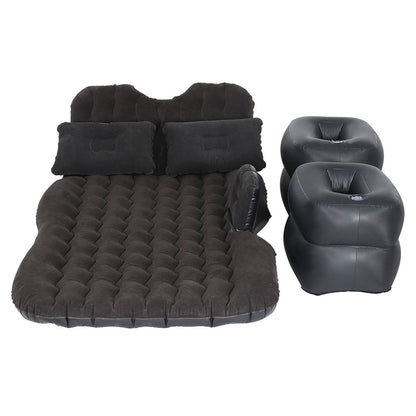 Inflatable car mattress and pillows in charcoal color, with foot pump, laid out on a white background.