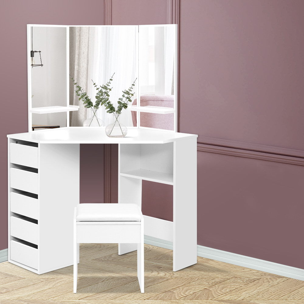Artiss Corner Dressing Table With Mirror Stool White Mirrors Makeup Tables Chair

Crafted with expert precision, our Artiss Dressing Table Set is a true masterpiece. Constructed from durable particle board and finished with PVC edging and melamine coating, this elegant dressing table boasts a multitude of practical features.