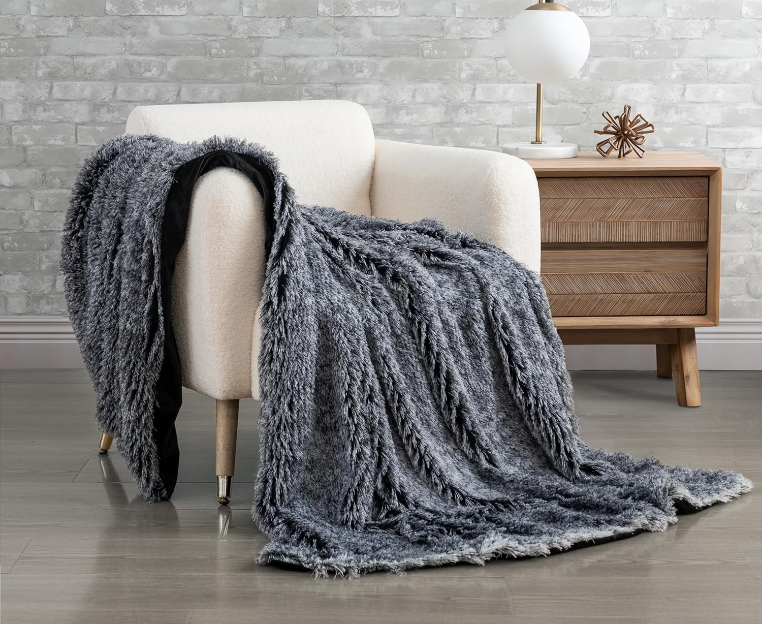Double-Sided Faux Fur Shaggy Throw Blanket - Charcoal

Wrap yourself in luxurious comfort with our Double Sided Faux Fur Shaggy Throw Blanket in Charcoal. Made with soft and cozy faux fur, this blanket is perfect for snuggling up on chilly nights. Its double-sided design adds a stylish touch to any living space. Experience the ultimate comfort and warmth with our throw blanket