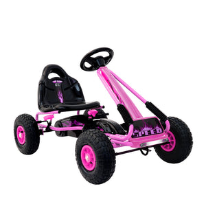 Pink and black toy go-kart on a white background