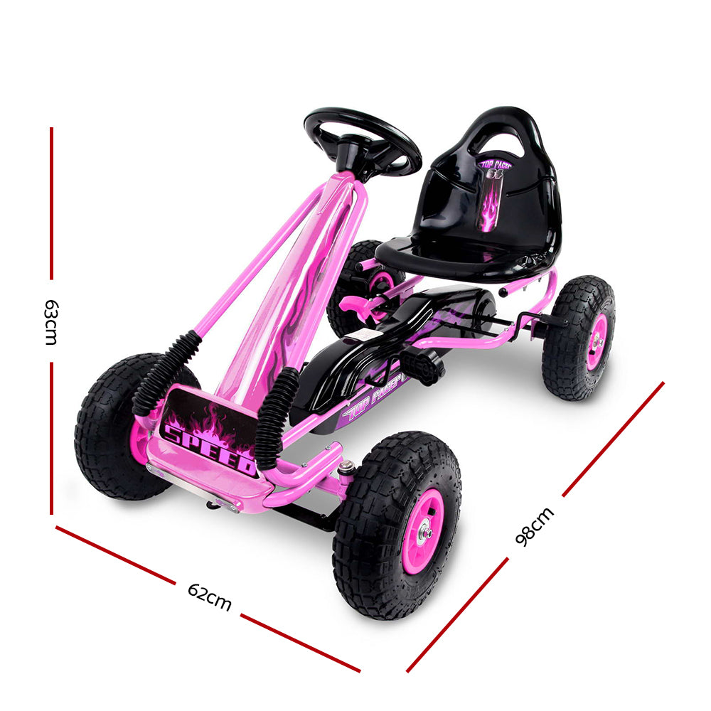 Pink and black pedal go-kart with measurements on a white background
