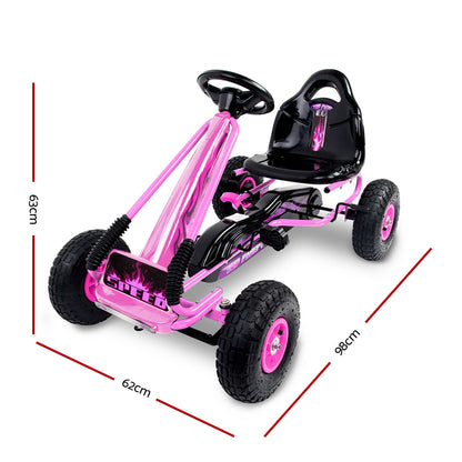 Pink and black pedal go-kart with measurements on a white background
