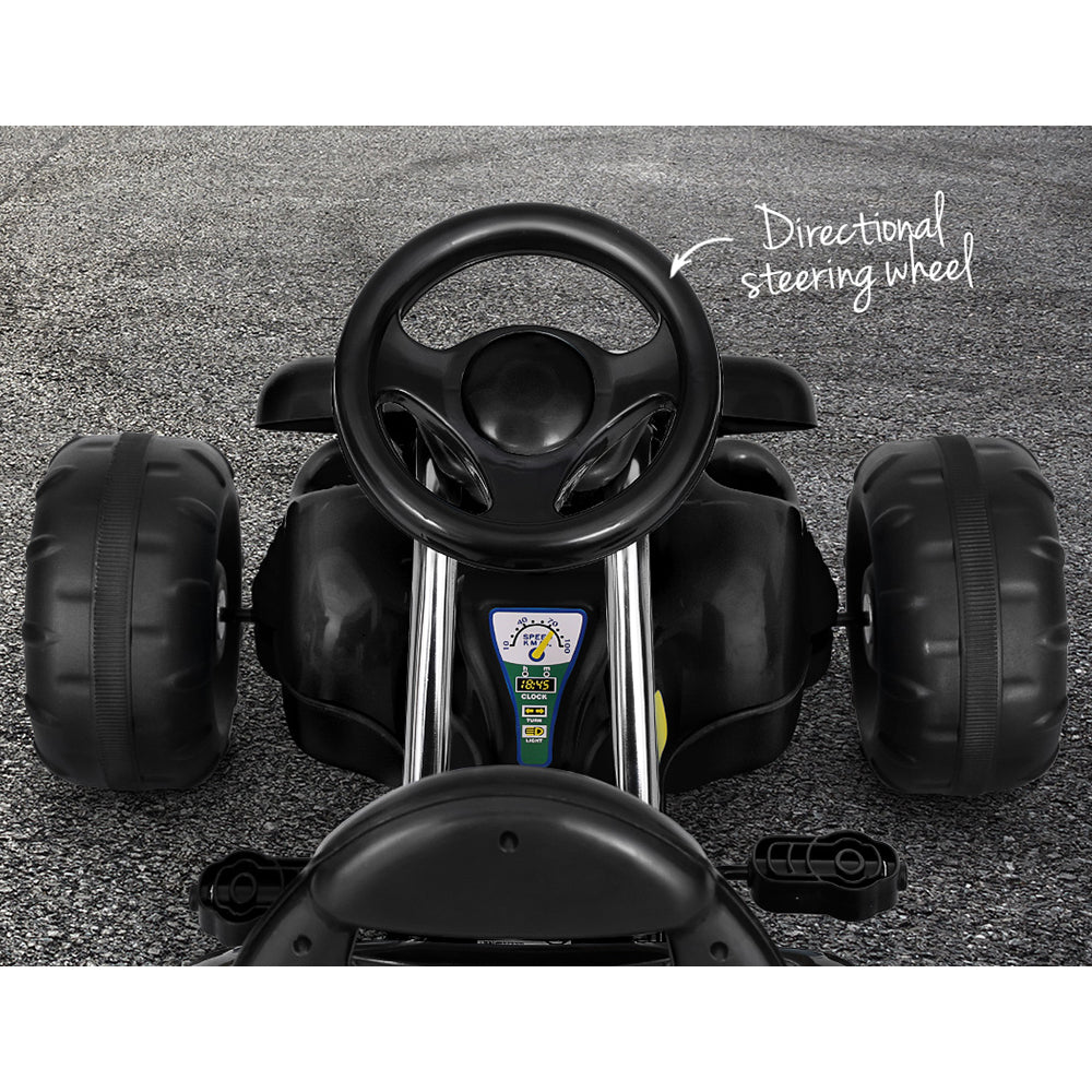 Children's toy car with steering wheel on a gray surface