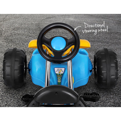 Blue children's pedal car with steering wheel on a gray surface