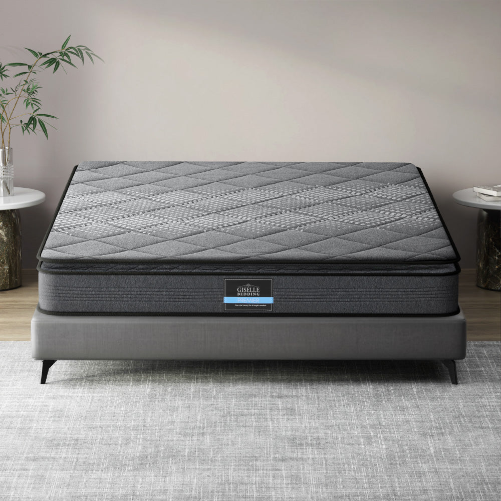A queen-sized Giselle Bedding Ella Series Pillow Top mattress with a thickness of 18cm, displayed on a bed frame in a room setting.