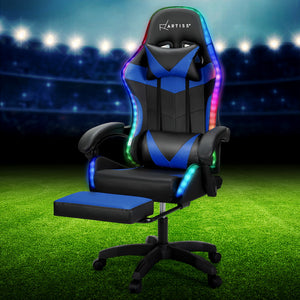 Artiss branded massage gaming office chair with blue and black color scheme, featuring a high back, lumbar support, adjustable headrest, and footrest, set against a LED light background.