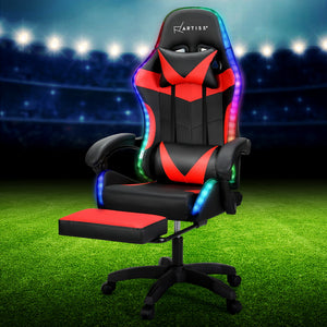 Artiss Massage Gaming Office Chair with 7 LED footrest, predominantly red and black in color, displayed in a simulated outdoor setting with LED lights in the background.