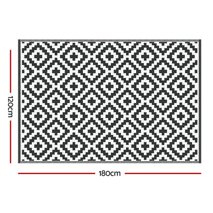 Black and white geometric patterned rug with dimensions on a white background