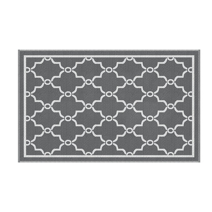 Gray and white geometric patterned rug on a white background