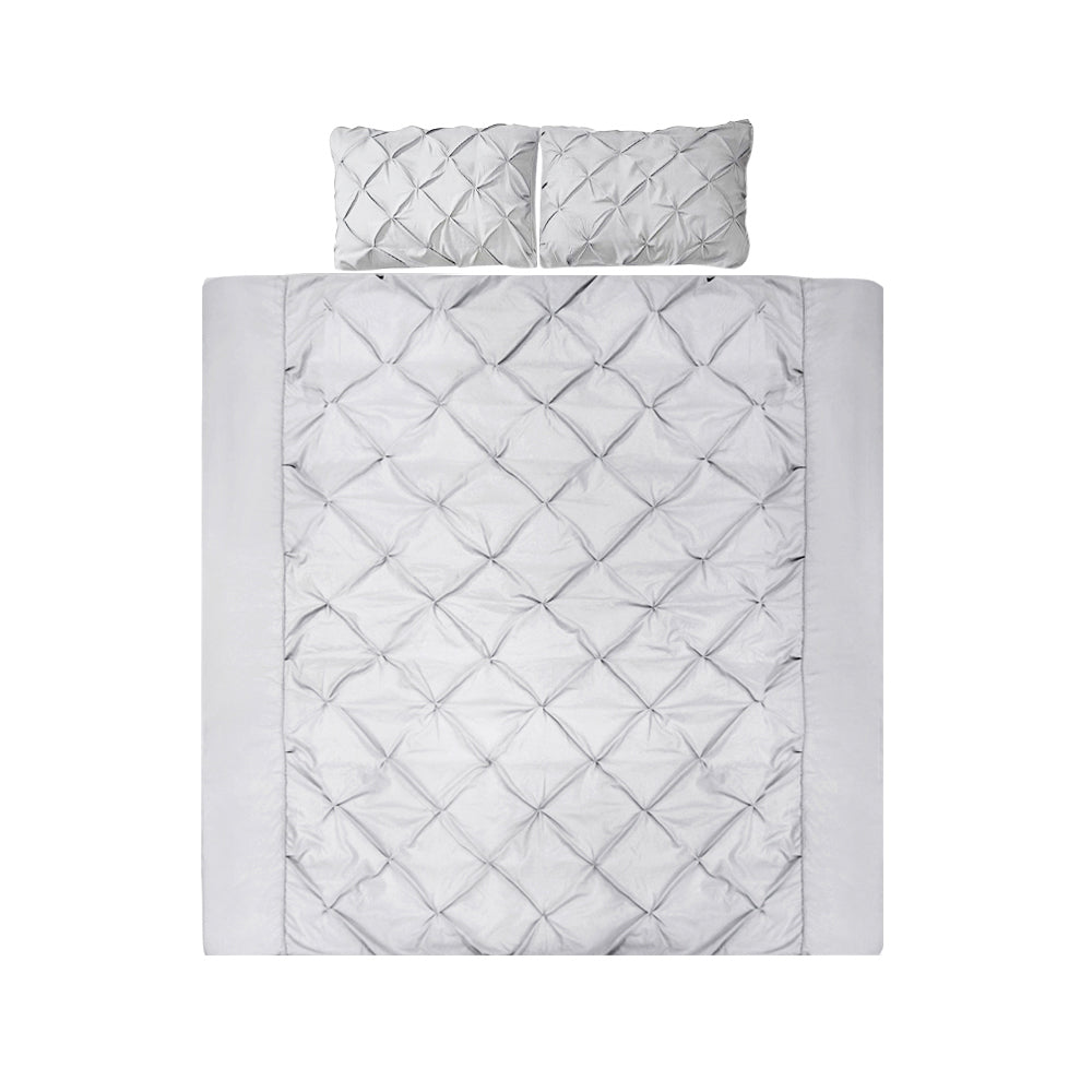 A grey quilt cover set with diamond pintuck design including two pillowcases.