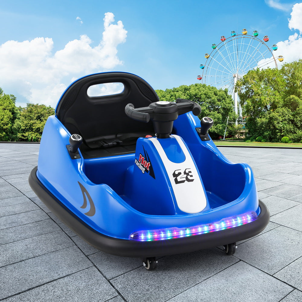 Blue children's bumper car with LED lights on a paved area with a Ferris wheel in the background.