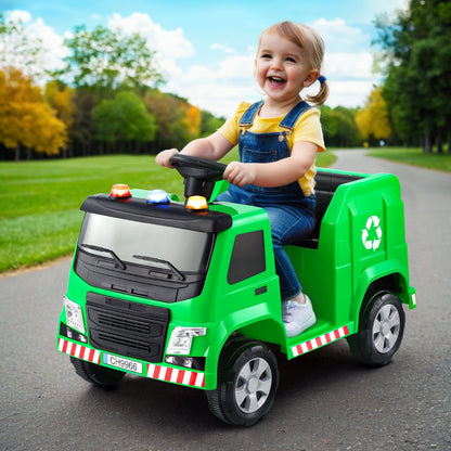 Child playing with a green toy garbage truck in an outdoor setting
