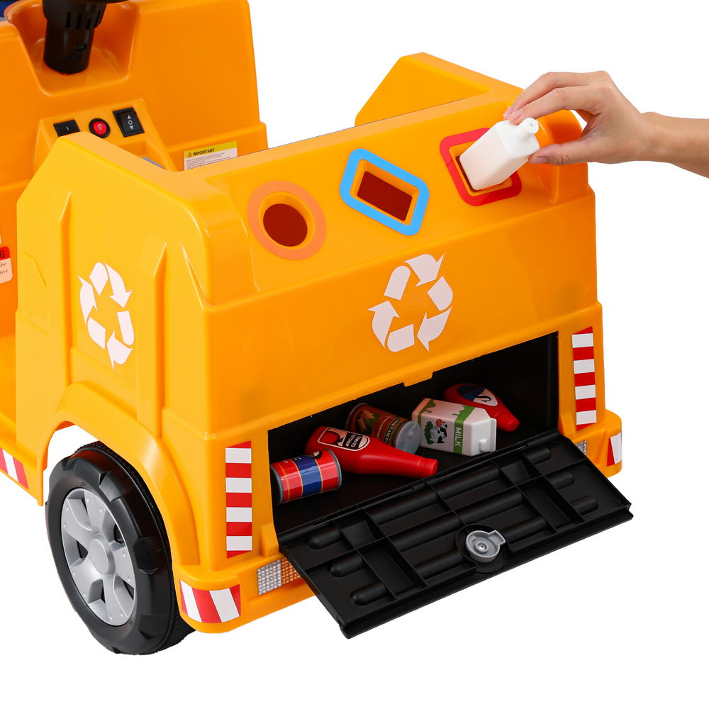 Toy garbage truck with open back showing simulated trash, on a white background