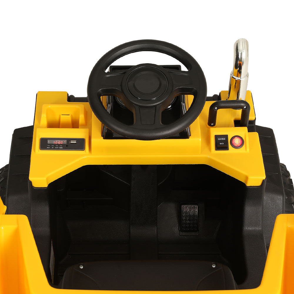 Close-up of a yellow toy car with a steering wheel on a white background