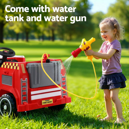 Child playing with a toy fire truck and water gun in a park