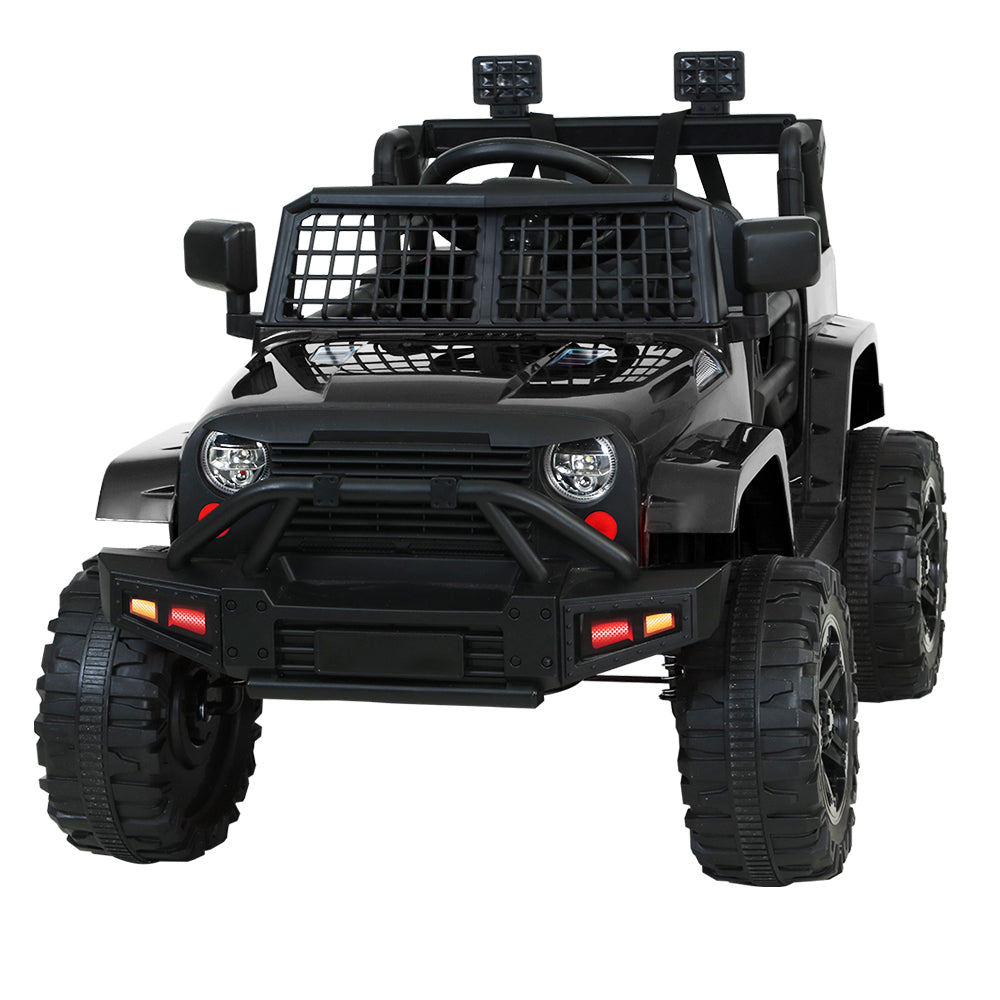 Black toy off-road vehicle with large wheels on a white background