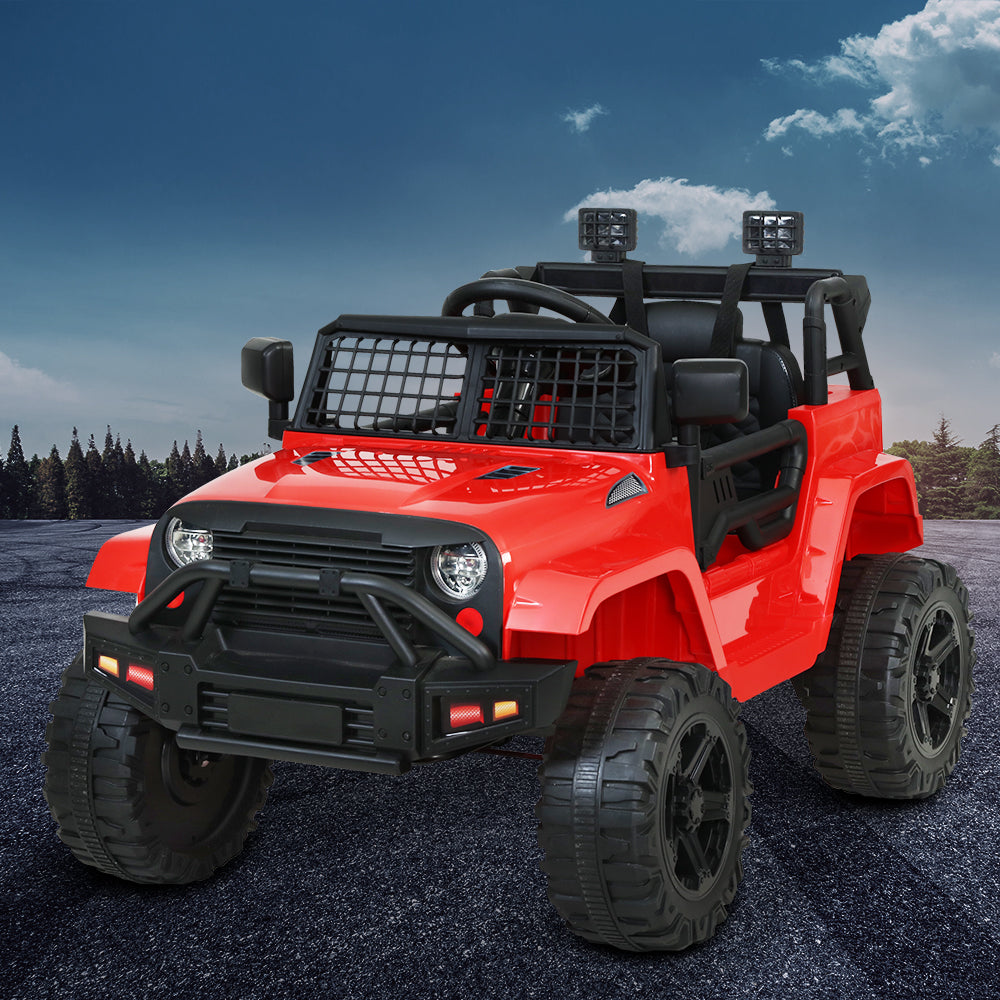Red toy jeep with black details on a gray surface with a blue sky background