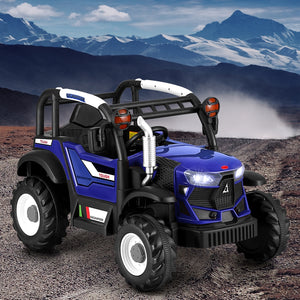 Blue toy truck with black roof on a rocky terrain with mountains in the background