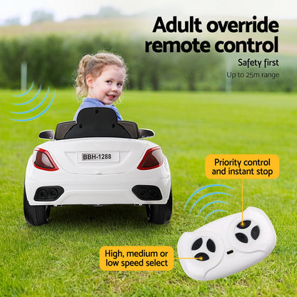 Child in a toy car with remote control and text about adult override remote control system.