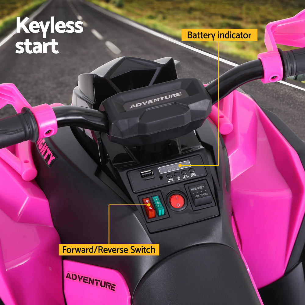 Close-up of a pink and black toy ATV with control panel and labeled features.