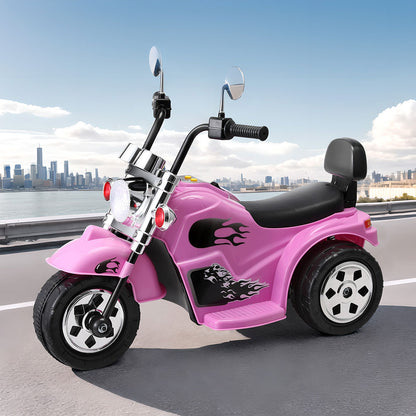 Pink toy motorcycle with flame designs on a road with a cityscape background