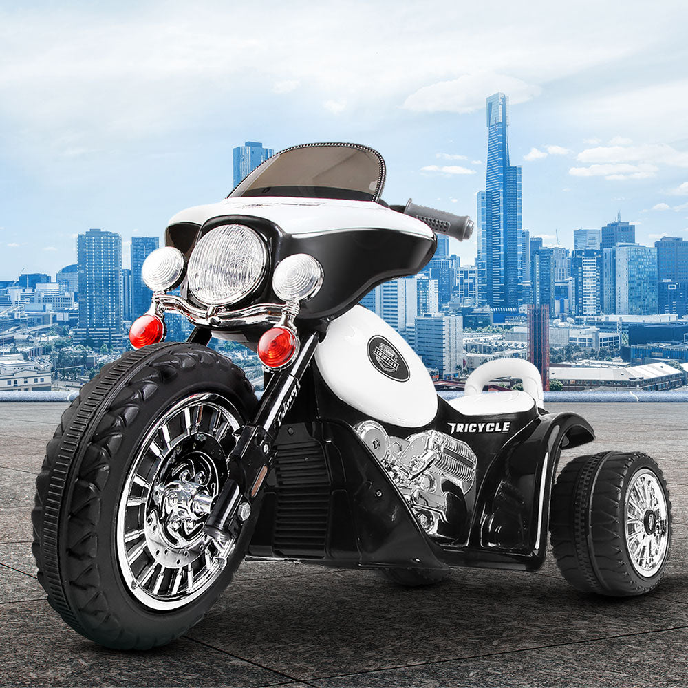 Black and white tricycle with city skyline in the background