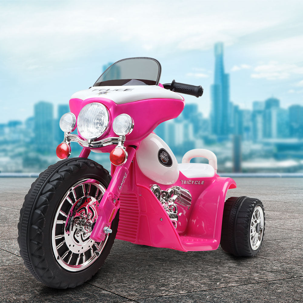 Pink toy motorcycle with cityscape background