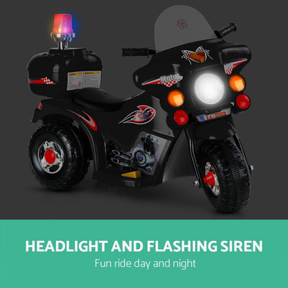 Children's toy motorcycle with headlight and flashing siren on a dark background