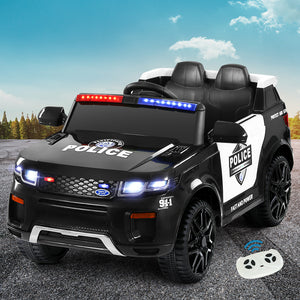 Children's toy police car with lights and a remote control on a road.