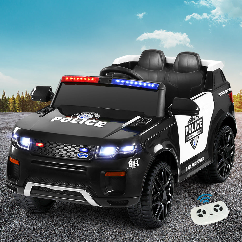 Children's toy police car with lights and a remote control on a road.