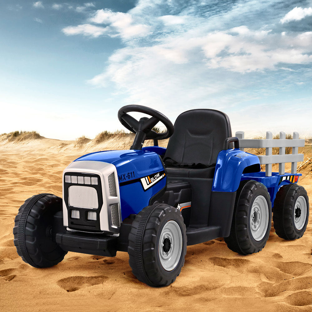 Blue toy tractor with a black seat and white wheels on sandy terrain under a blue sky.